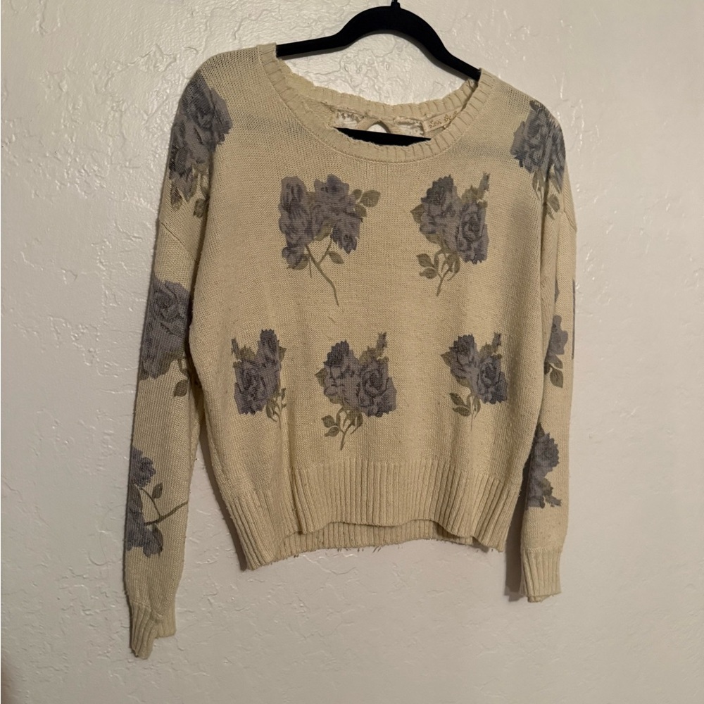 Cream floral sweater with small opening in the back